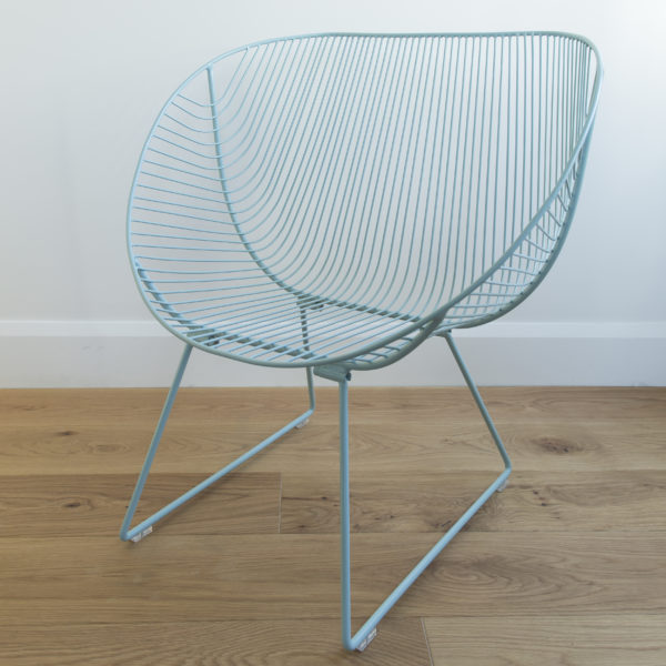 A mid century, 60's style, rounded wire outdoor chair in colour Aqua