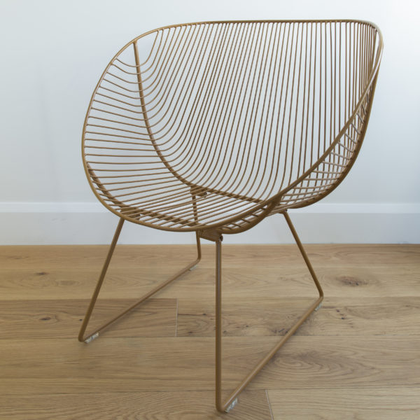 Mid century style outdoor patio chair, seat and legs are made of Tobacco coloured wire.