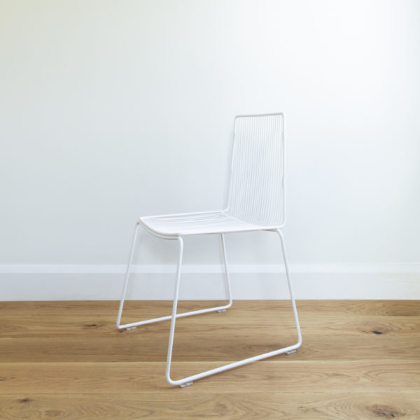 Angle view of white metal wire dining chair. Outdoor wire furniture. Devonport chair by Ico Traders