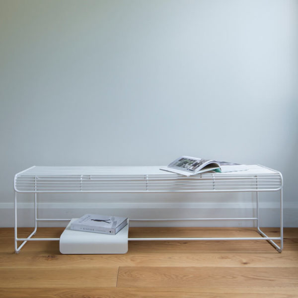 Outdoor wire Benmore bench seat, a white moveable solid plate sits on the bottom rungs