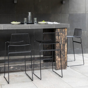 Dunedin Barleaner Stool – stackable stainless steel outdoor bar stool with minimalist wire-frame design.