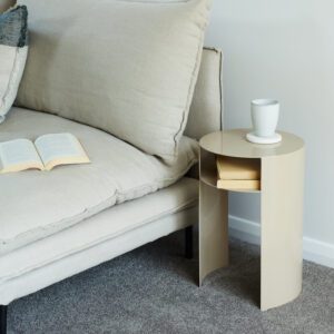 Waipuna stainless steel outdoor side table with built-in shelf, styled with wire outdoor furniture.