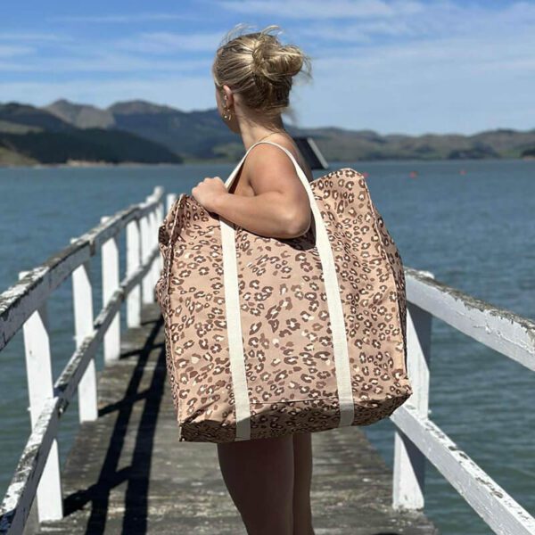 Oversized canvas bag used for travel and storage in Animal Crackers design