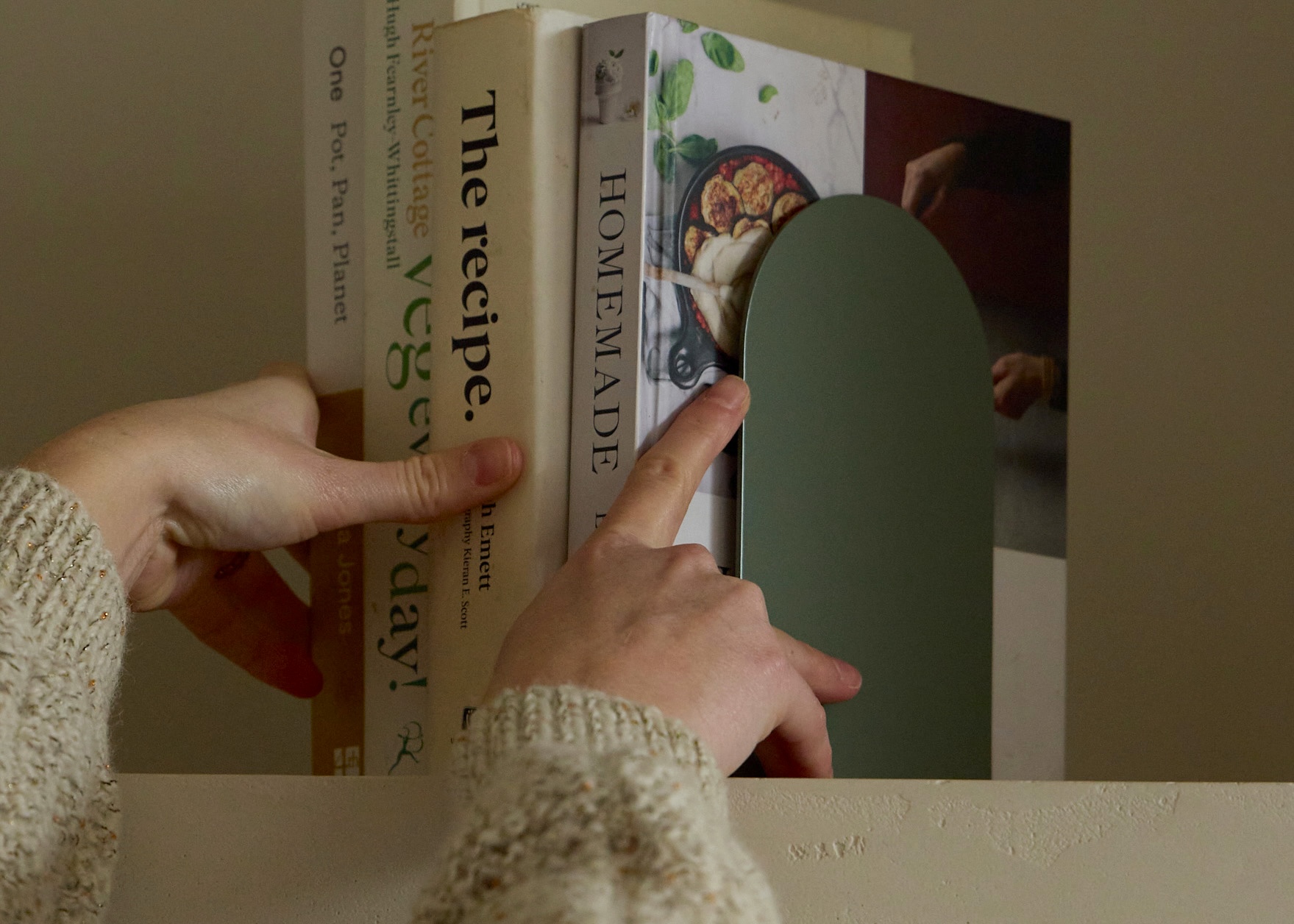 Sage JAMB Bookends holding cookbooks on a shelf in a contemporary New Zealand home.
