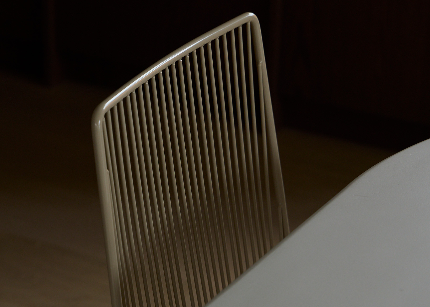 Devonport Dining Chair in Putty showcasing the minimalist powder-coated, solid steel wire backrest.