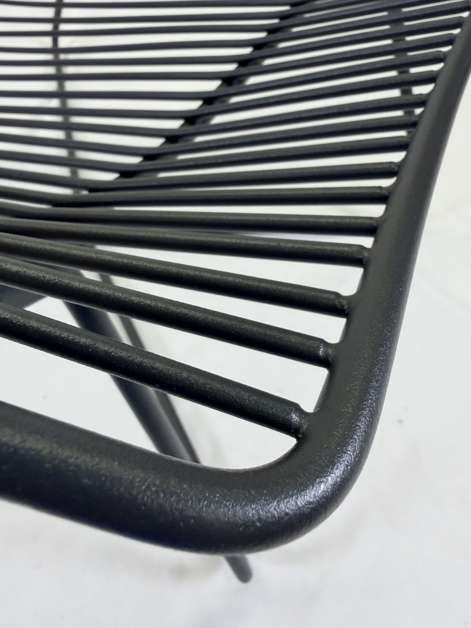 Up close image of Ico Traders wire chair, in new carbon matte colour-way.