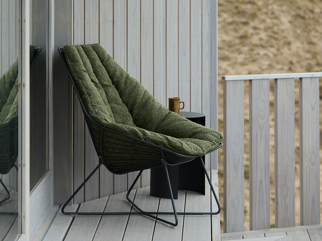Outdoor cushions, chairs and side tables. Made of stainless steel to withstand the New Zealand climate.