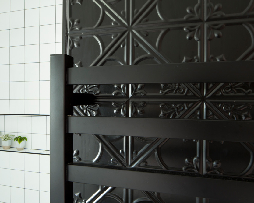 Pressed Tin panel in Snowflake design, powdercoated matte black & used in Ico Traders' NZ bathroom.